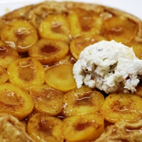 Image of Ontario plum tatin with hazelnut yogurt semifreddo.