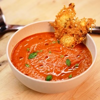 Image of tomato soup with parmesan crisps