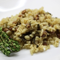 Image of rice and peas with callaloo.