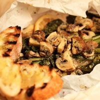 Image of miso mushroom and rapini crostini.