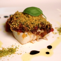 Image of a piece of the Cornflake and Herb Crusted White Fish with Bell Pepper Sauce 