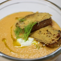 Image of tomato and fennel soup with grilled cheese crostini.