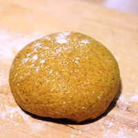Image of a ball of pumpkin pasta dough
