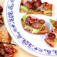 Image of roasted grape & walnut crostini with creamy avocado recipe