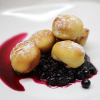 Image of mini sufganyot filled with blueberry, lemon and sumac jelly.