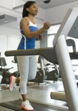 Image of a woman running on a treadmill