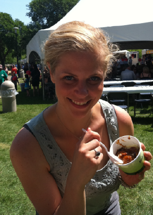 Christy enjoying some buttertart ice cream at a food fair in Saskatchewan.