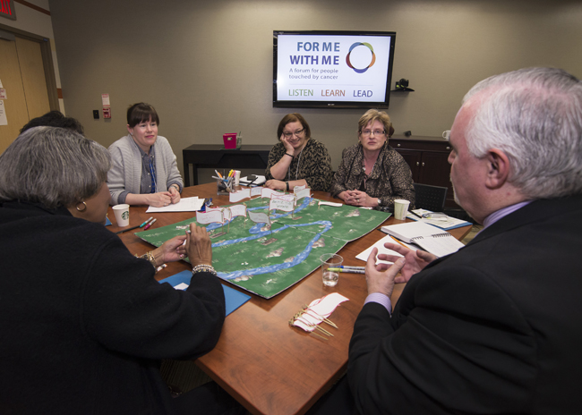 Image of a group of people sitting around a table