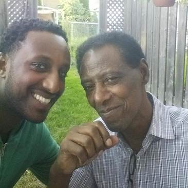 Image of Aman and his father