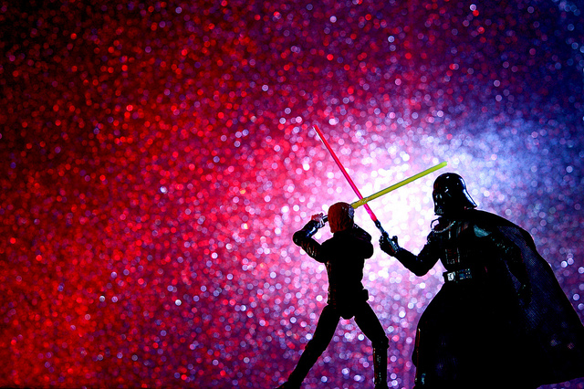 Image of lego version of Luke Skywalker fightin Darth Vader