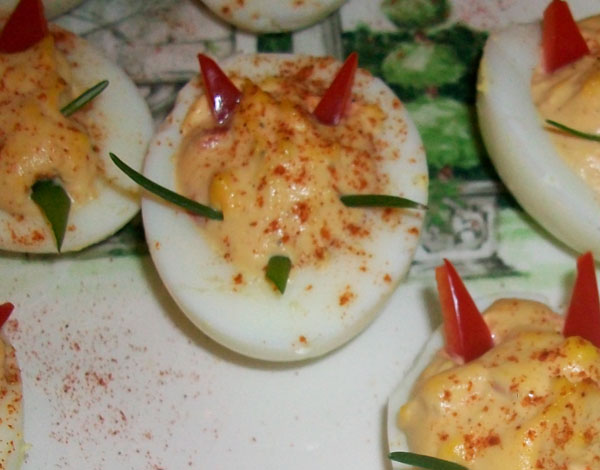 Image of deviled egg garnished to look like the Devil