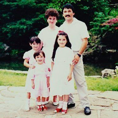 Image of a family portrait of Irene, her parents, and her two older sisters