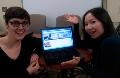 Image of Alaina and Aileen with a computer