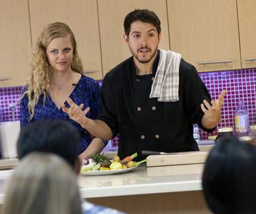 Image of Geremy and Christy during a cooking demonstration
