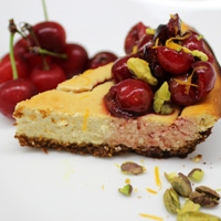 Image of a slice of the Sour Cherry & Pistachio Cheesecake