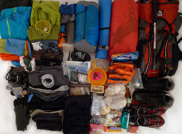 Image of rucksack with assorted camping gear